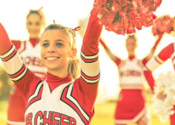 High school football team show incredible compassion to cancer-stricken cheerleader.
